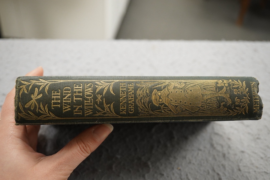 Grahame, Kenneth - The Wind in the Willows ... First Edition. frontispiece (by Graham Robertson) and tissue guard, half title; original gilt ruled and pictorial cloth, gilt top with other edges rough trimmed. Methuen and